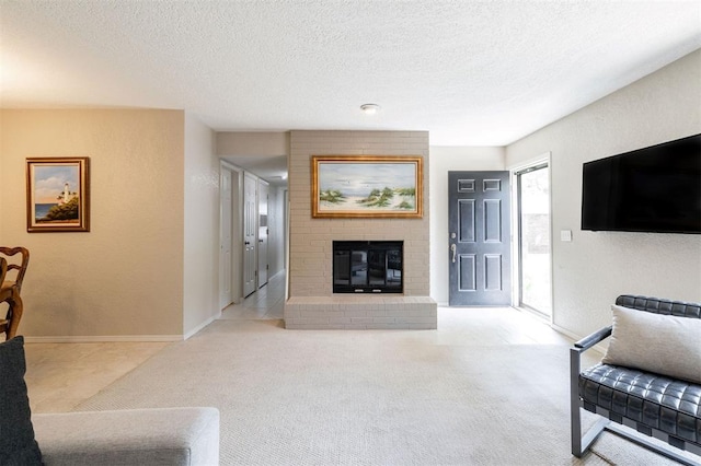 carpeted living room featuring baseboards, a textured ceiling, and a brick fireplace