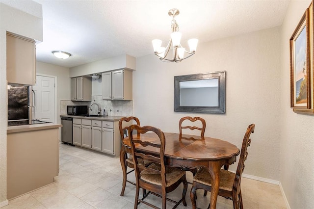 dining space with baseboards, a chandelier, and light tile patterned floors