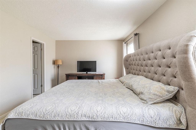 bedroom featuring a textured ceiling