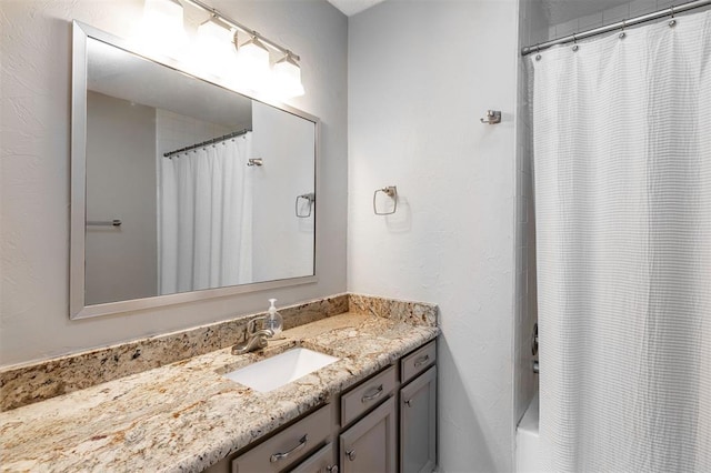 full bathroom with vanity and shower / tub combo with curtain