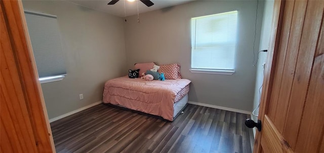 bedroom featuring ceiling fan, baseboards, and dark wood-type flooring