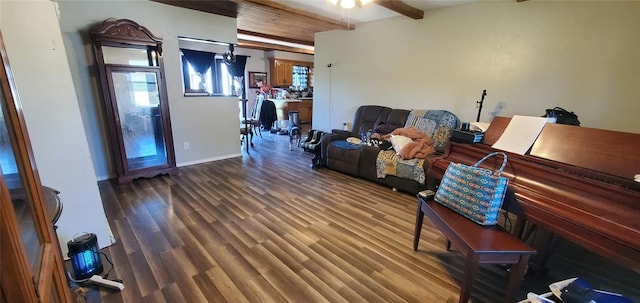 living area featuring baseboards, ceiling fan, and wood finished floors