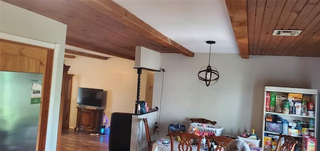 234 S 5th Ave, Stroud, OK 74079 - dining area with wood ceiling, wood finished floors, and beam ceiling