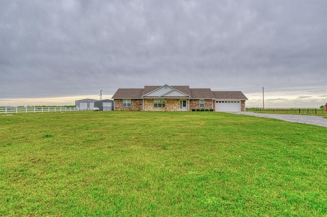 34701 E County Road 1610, Pauls Valley, OK 73075 - ranch-style house with fence, an attached garage, a front lawn, and gravel driveway