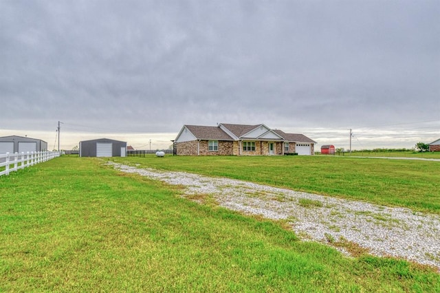 34701 E County Road 1610, Pauls Valley, OK 73075 - exterior space with a front lawn, driveway, fence, and a detached garage