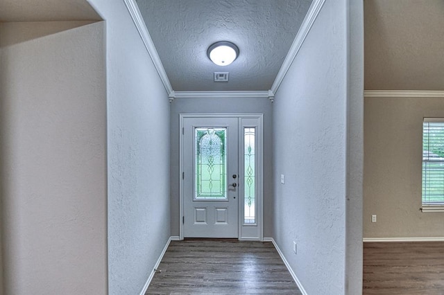 34701 E County Road 1610, Pauls Valley, OK 73075 - foyer with baseboards, a textured ceiling, a textured wall, and wood finished floors