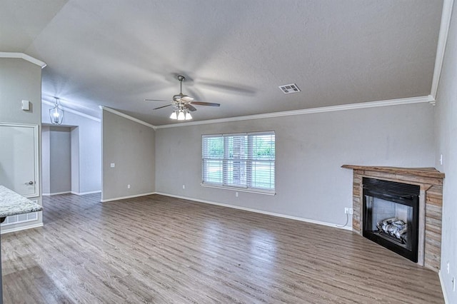 34701 E County Road 1610, Pauls Valley, OK 73075 - unfurnished living room featuring lofted ceiling, wood finished floors, ceiling fan, baseboards, and a glass covered fireplace