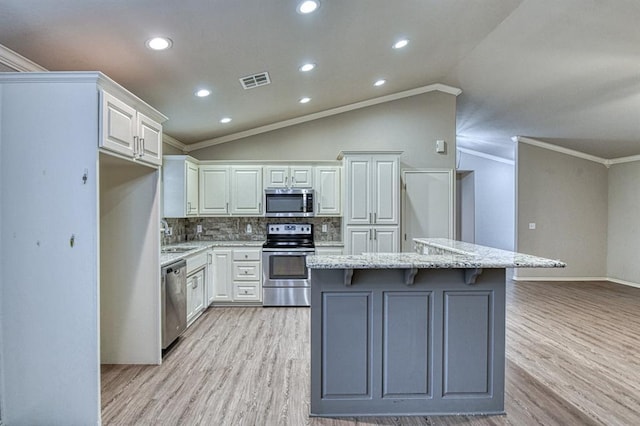 34701 E County Road 1610, Pauls Valley, OK 73075 - kitchen with crown molding, light wood-style floors, stainless steel appliances, and visible vents