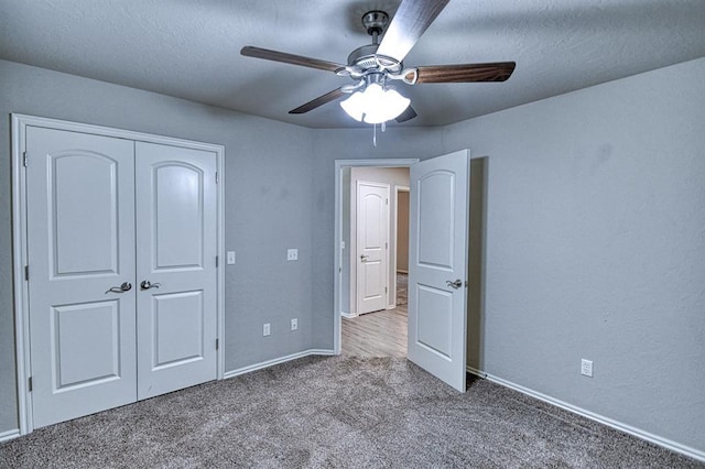 34701 E County Road 1610, Pauls Valley, OK 73075 - unfurnished bedroom with carpet, a closet, baseboards, and a ceiling fan