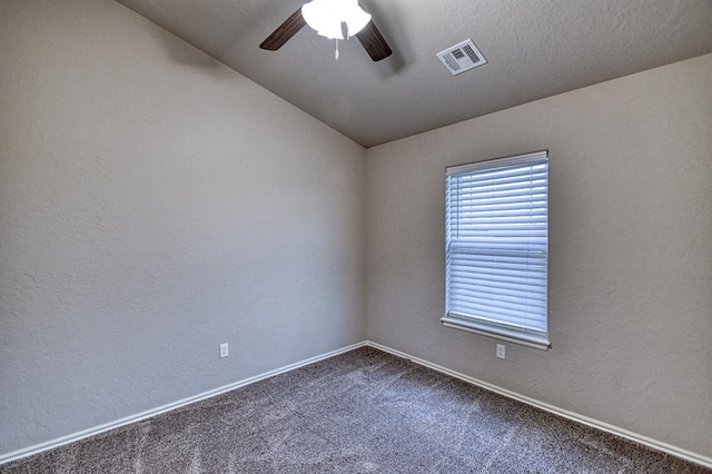 34701 E County Road 1610, Pauls Valley, OK 73075 - unfurnished room featuring visible vents, vaulted ceiling, ceiling fan, baseboards, and dark carpet