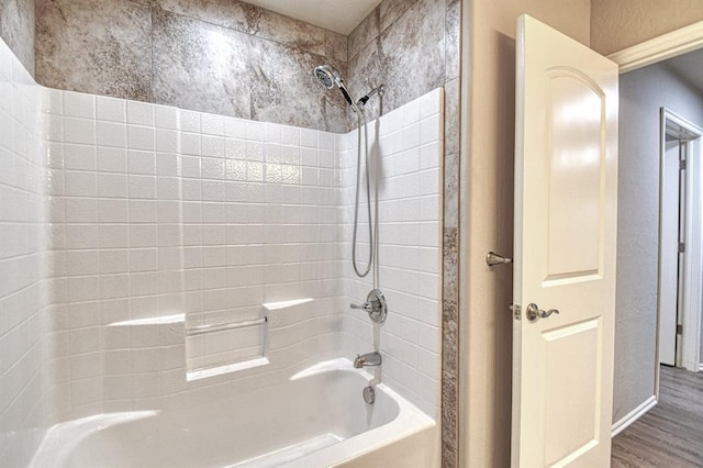 34701 E County Road 1610, Pauls Valley, OK 73075 - bathroom with baseboards, shower / bath combination, and wood finished floors