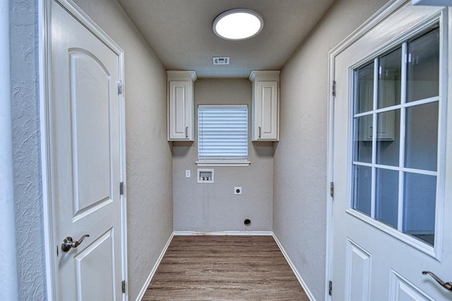 34701 E County Road 1610, Pauls Valley, OK 73075 - laundry room featuring visible vents, dark wood-style flooring, electric dryer hookup, baseboards, and hookup for a washing machine