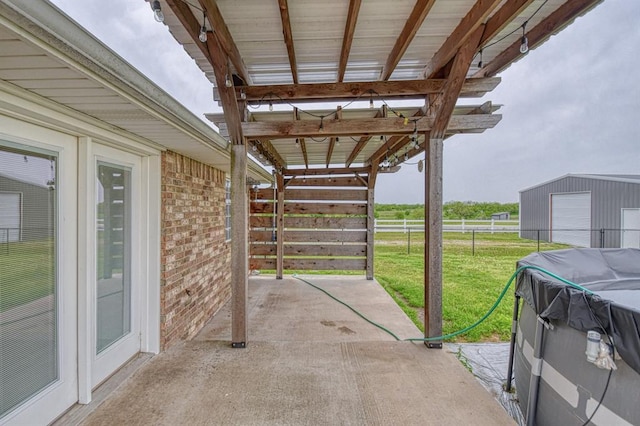34701 E County Road 1610, Pauls Valley, OK 73075 - view of patio / terrace with a garage and fence