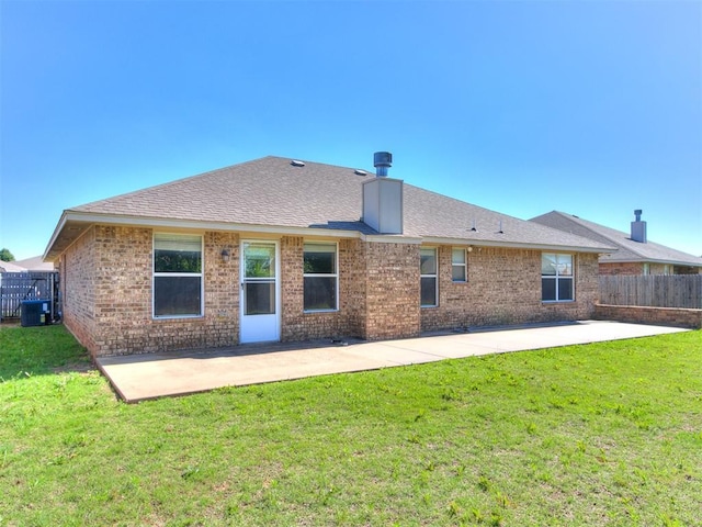 8233 Greer Way, Oklahoma City, OK 73132 - rear view of property featuring a patio area, central AC, brick siding, and a chimney