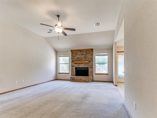 8233 Greer Way, Oklahoma City, OK 73132 - unfurnished living room with vaulted ceiling, light colored carpet, a ceiling fan, a brick fireplace, and baseboards