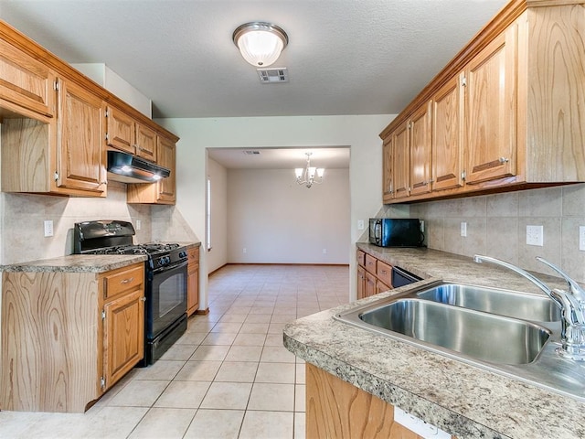 8233 Greer Way, Oklahoma City, OK 73132 - kitchen with black appliances, under cabinet range hood, a sink, light tile patterned floors, and tasteful backsplash