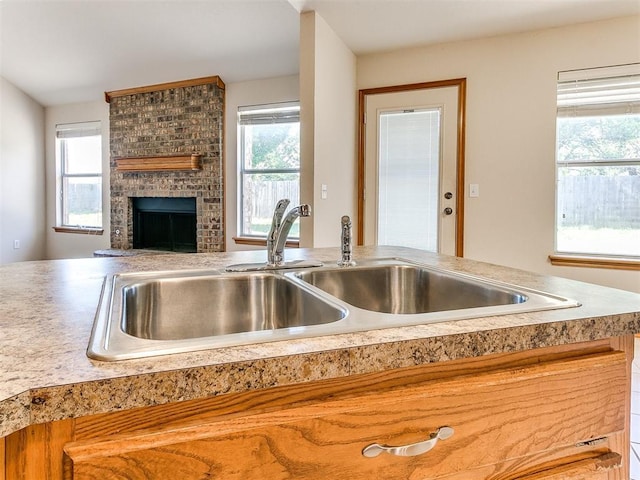 8233 Greer Way, Oklahoma City, OK 73132 - kitchen with a sink, plenty of natural light, and a fireplace