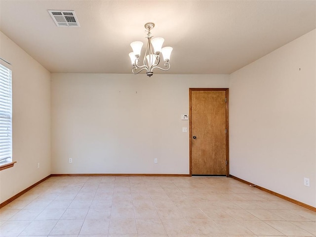 8233 Greer Way, Oklahoma City, OK 73132 - spare room with a chandelier, plenty of natural light, baseboards, and light tile patterned floors