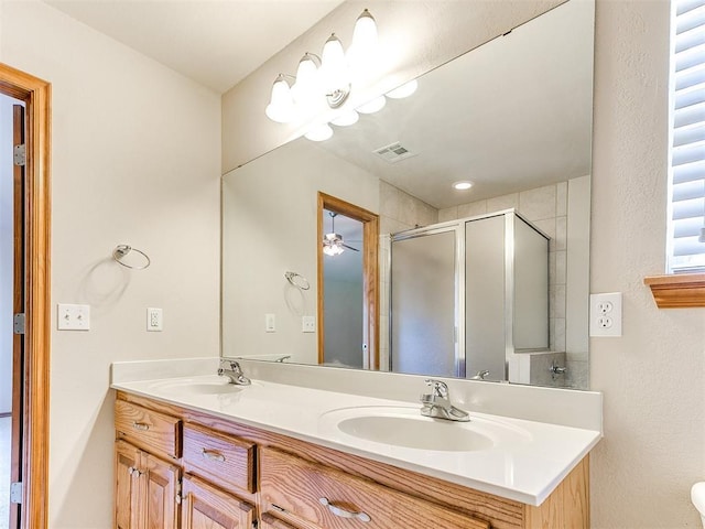 8233 Greer Way, Oklahoma City, OK 73132 - full bath featuring a shower stall, double vanity, and ceiling fan
