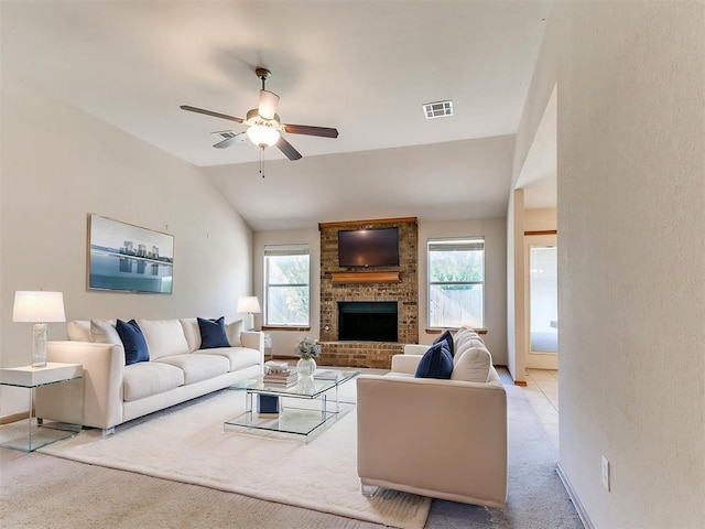 8233 Greer Way, Oklahoma City, OK 73132 - carpeted living room featuring vaulted ceiling, ceiling fan, and a fireplace