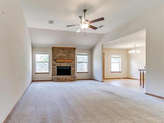 8233 Greer Way, Oklahoma City, OK 73132 - unfurnished living room featuring carpet floors, a fireplace, ceiling fan, lofted ceiling, and a chandelier