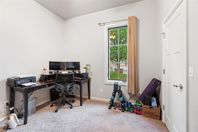 carpeted office space featuring baseboards