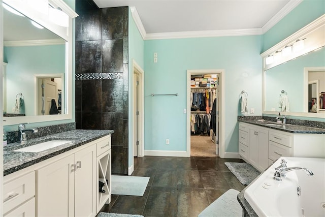 full bathroom with crown molding, a whirlpool tub, and a sink