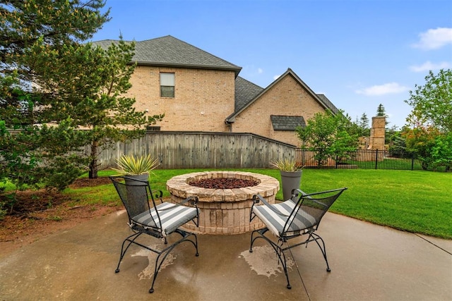 view of patio / terrace with an outdoor fire pit and a fenced backyard