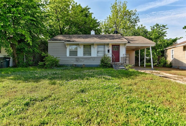3924 Teal Dr, Del City, OK 73115 - view of front of home with a carport, a front yard, driveway, and a chimney