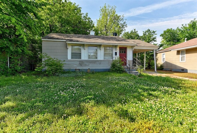 3924 Teal Dr, Del City, OK 73115 - view of front of house featuring an attached carport and a front lawn