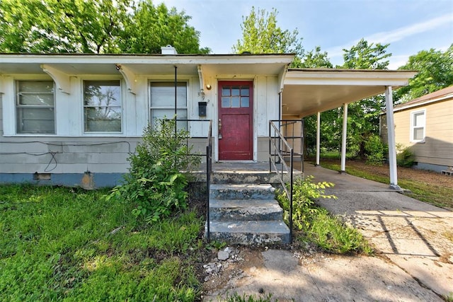 3924 Teal Dr, Del City, OK 73115 - property entrance with crawl space, an attached carport, and concrete driveway