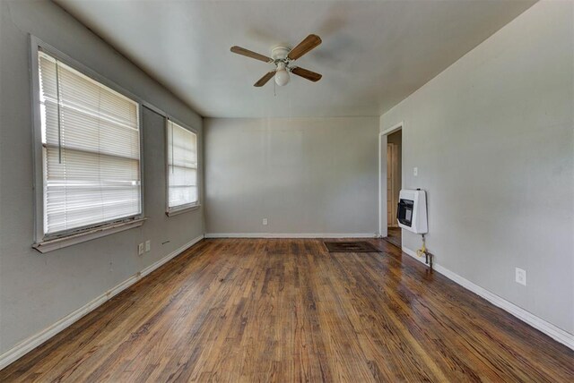 3924 Teal Dr, Del City, OK 73115 - unfurnished living room with heating unit, ceiling fan, wood finished floors, and baseboards