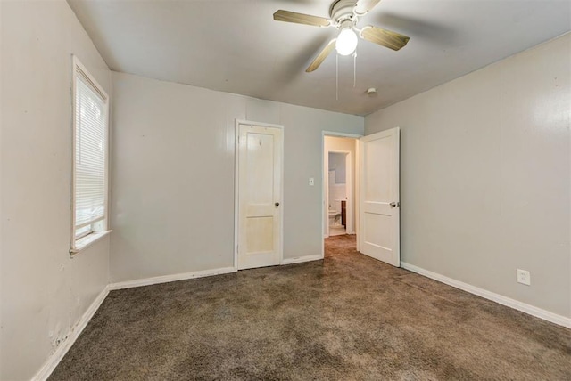 3924 Teal Dr, Del City, OK 73115 - unfurnished bedroom with multiple windows, carpet, and baseboards