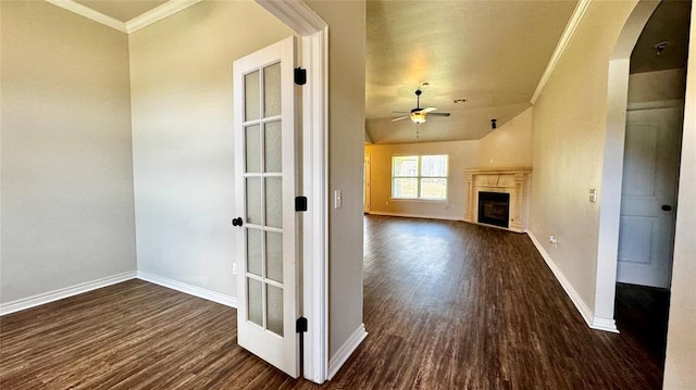 1328 Ridgeway Dr, Moore, OK 73160 - unfurnished living room with dark wood finished floors, ornamental molding, arched walkways, ceiling fan, and a fireplace