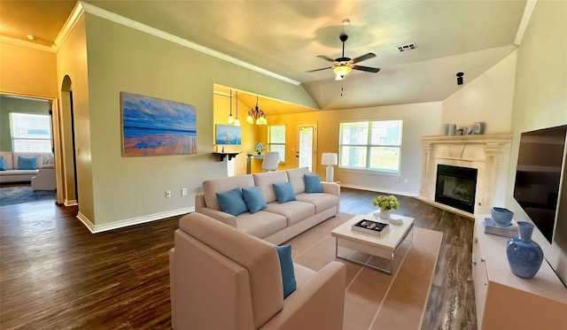 1328 Ridgeway Dr, Moore, OK 73160 - living area featuring wood finished floors, crown molding, a ceiling fan, a fireplace, and lofted ceiling