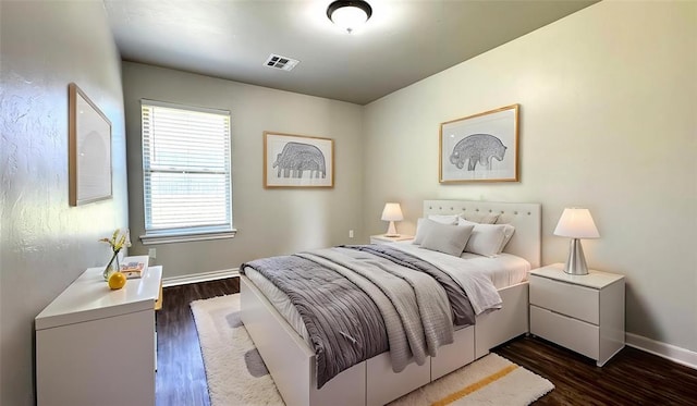 1328 Ridgeway Dr, Moore, OK 73160 - bedroom featuring dark wood-style floors and baseboards