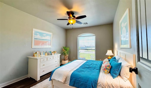 1328 Ridgeway Dr, Moore, OK 73160 - bedroom featuring dark wood finished floors and ceiling fan