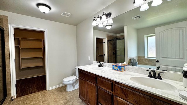 1328 Ridgeway Dr, Moore, OK 73160 - full bath with a stall shower, double vanity, a bath, a spacious closet, and tile patterned floors