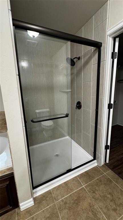 1328 Ridgeway Dr, Moore, OK 73160 - full bathroom featuring a stall shower, tile patterned floors, and vanity