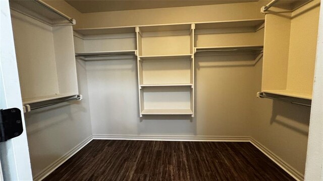 1328 Ridgeway Dr, Moore, OK 73160 - spacious closet with dark wood-style flooring