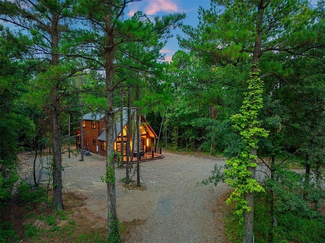 view of play area featuring a wooded view