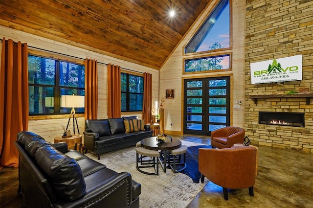 building lobby with wood ceiling, high vaulted ceiling, and wooden walls