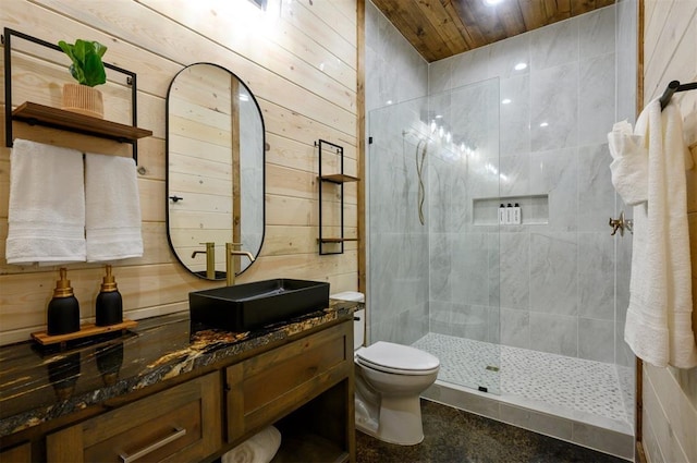 bathroom with a walk in shower, toilet, vanity, wood walls, and wood ceiling