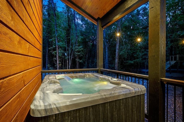 deck featuring a hot tub