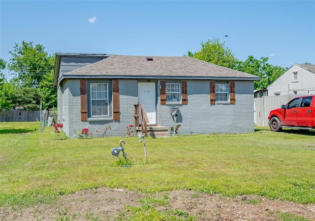 2717 SW 42nd St, Oklahoma City, OK 73119 - bungalow featuring fence, a front lawn, and brick siding