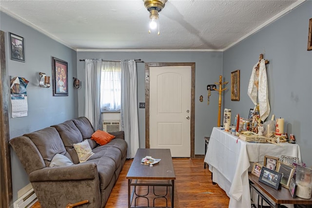 2717 SW 42nd St, Oklahoma City, OK 73119 - living area with baseboard heating, crown molding, a textured ceiling, and wood finished floors