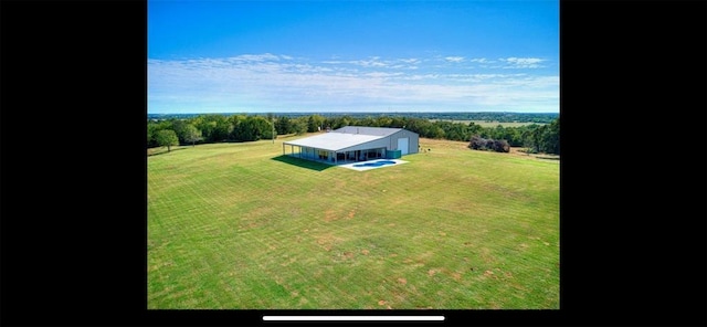 birds eye view of property featuring a rural view