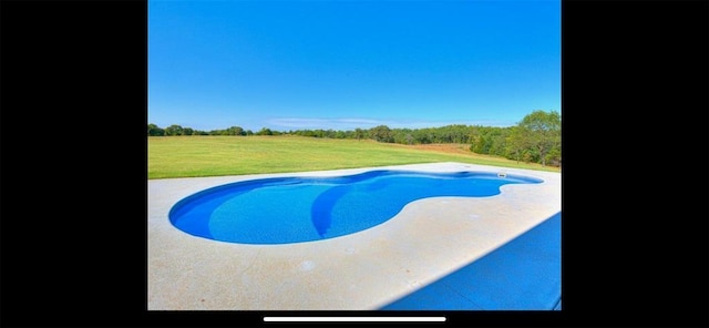 pool featuring a yard