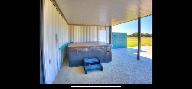 view of patio / terrace featuring a hot tub