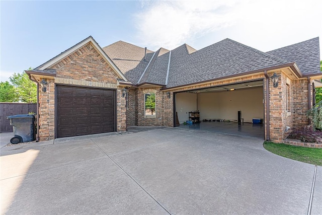 2612 SW 137th St, Oklahoma City, OK 73170 - view of front of property with driveway, a garage, and a shingled roof
